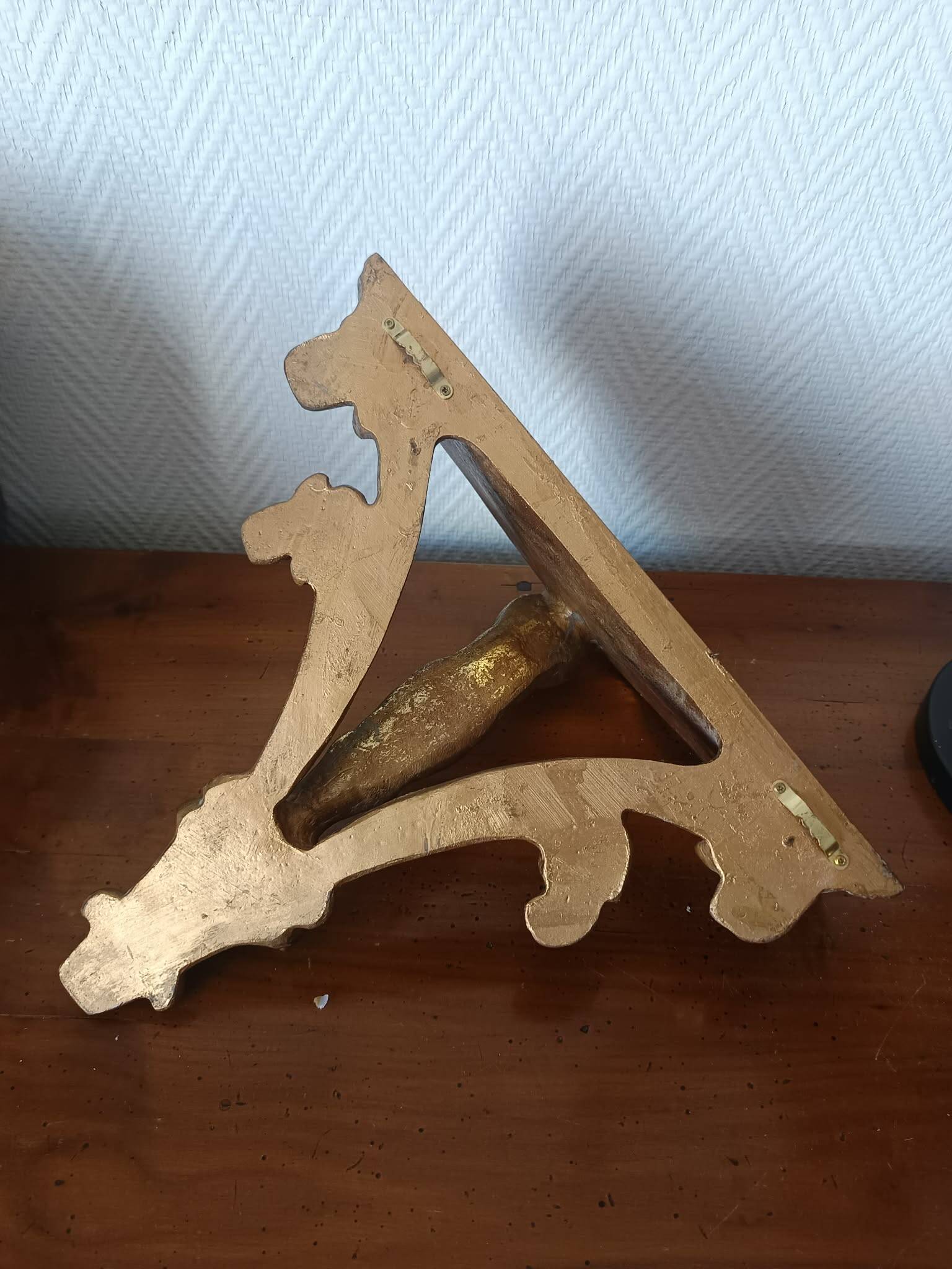 Golden wood wall console in Louis XV style.