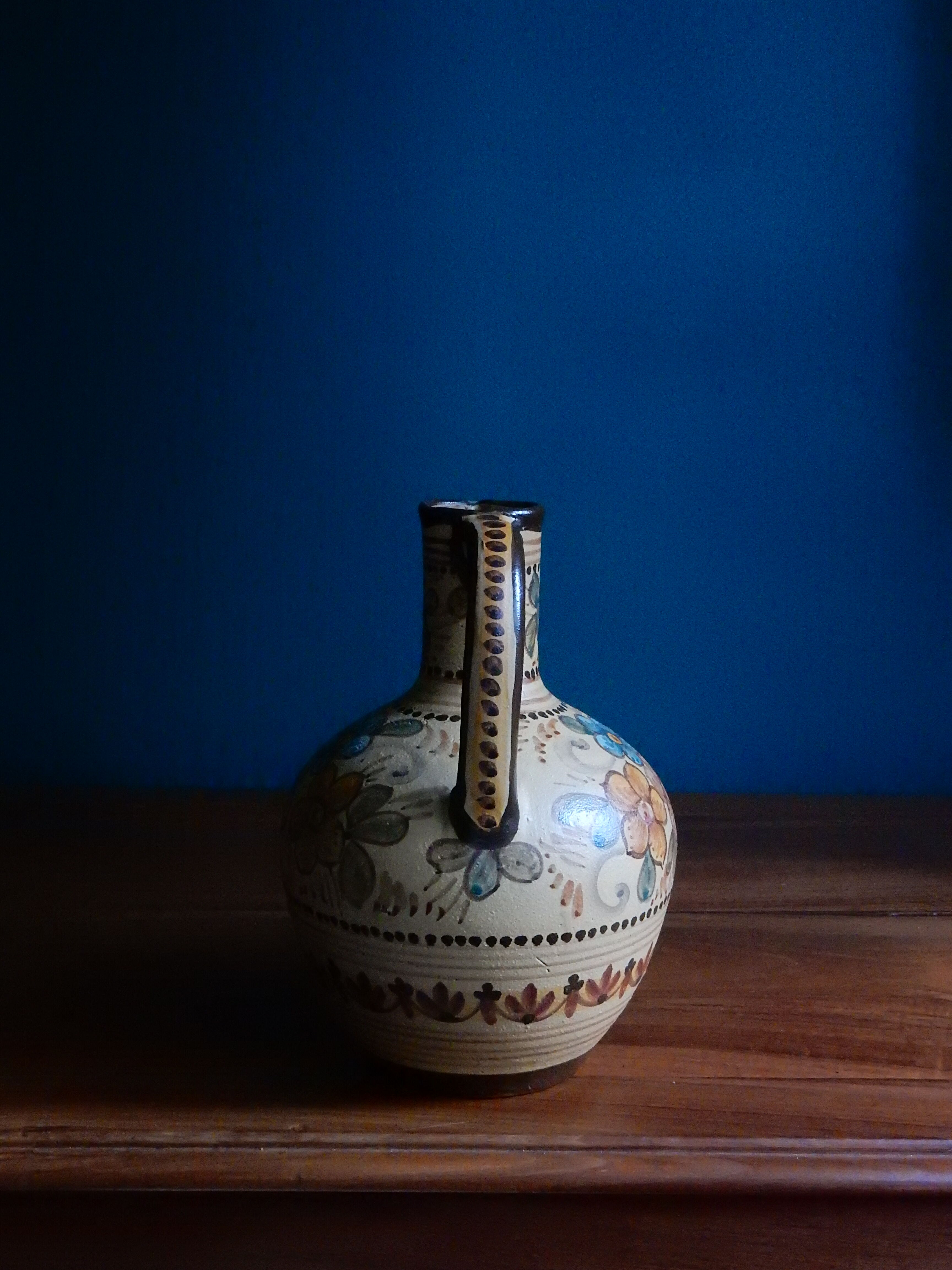 Hand-painted terracotta jug