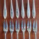 12 silver-plated metal condiment forks for shellfish by Christofle, Albi model.