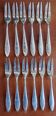12 silver-plated metal condiment forks for shellfish by Christofle, Albi model.