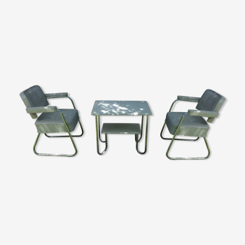 Pair of chairs with chrome tubular base sled and living room table with tubular base
