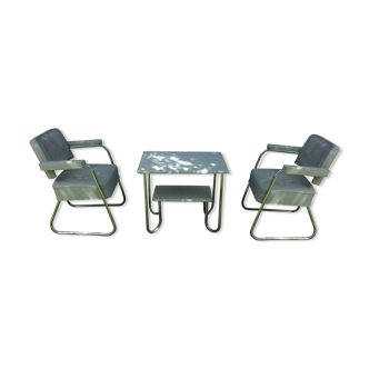 Pair of chairs with chrome tubular base sled and living room table with tubular base