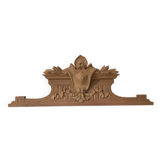 Old sandblasted wooden pediment