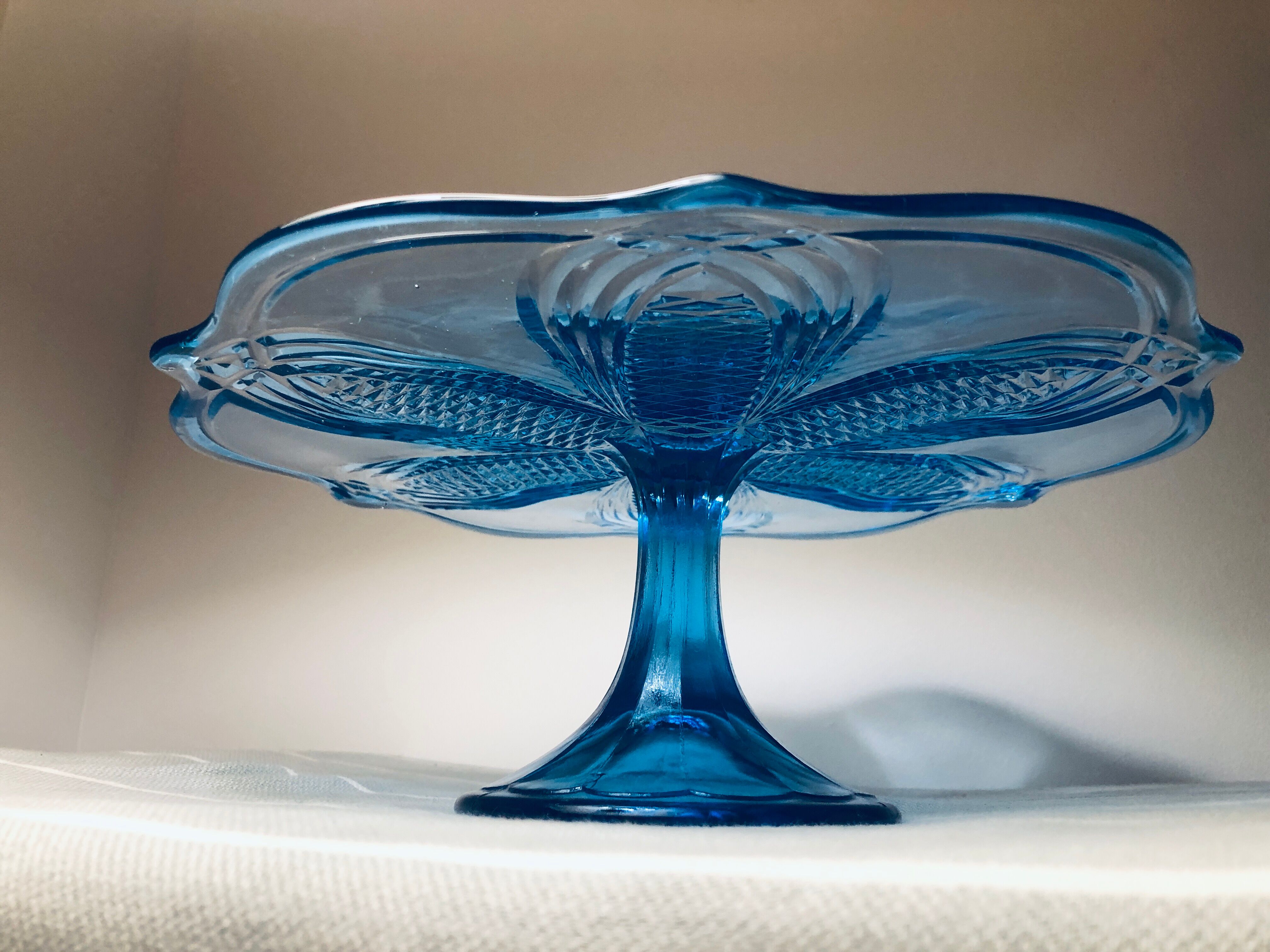 Blue vintage glass cake display