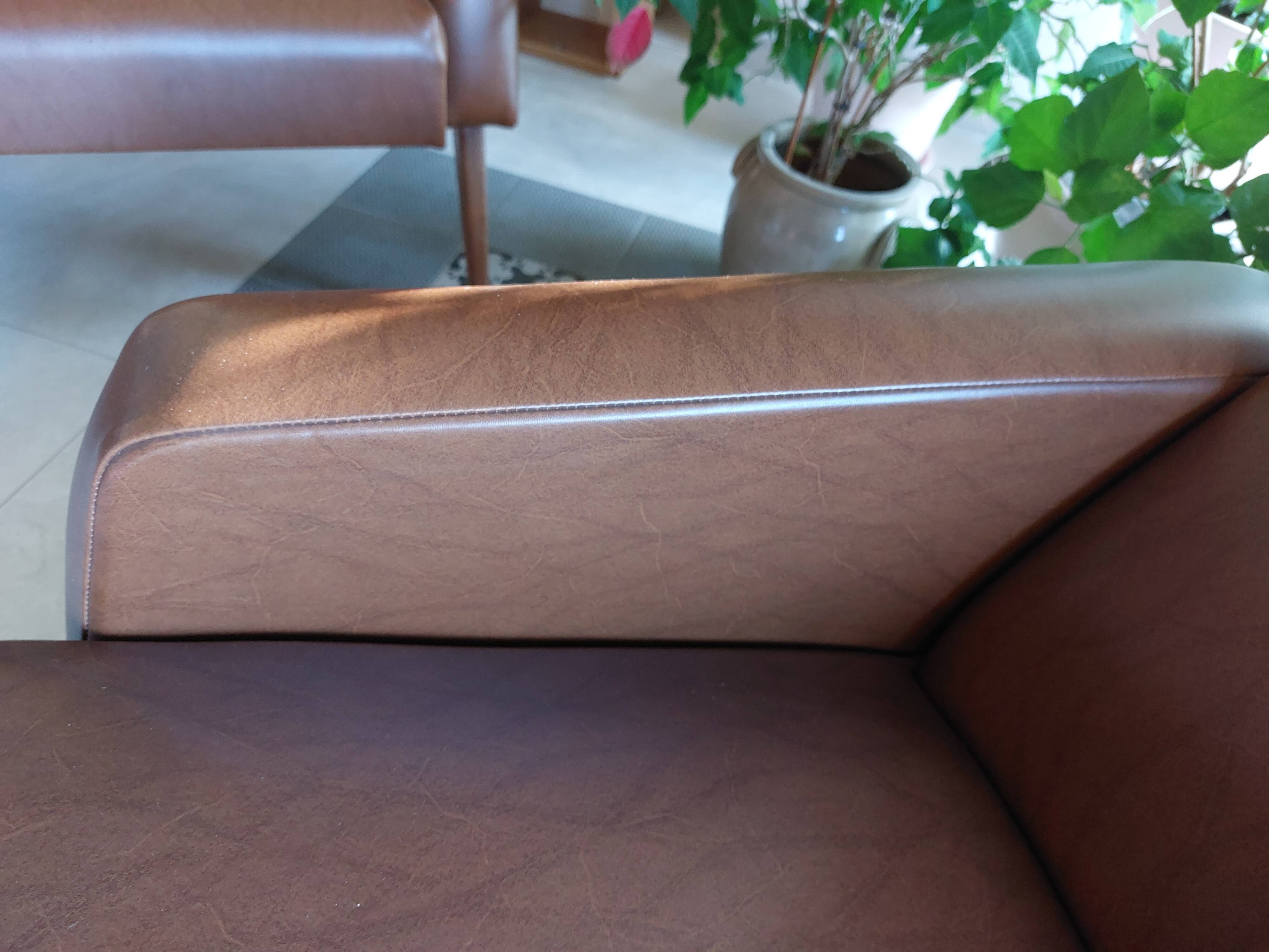 a pair of comfortable vintage armchairs with splayed legs