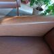 a pair of comfortable vintage armchairs with splayed legs