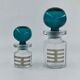 Two vintage 70s glass and metal bottles
