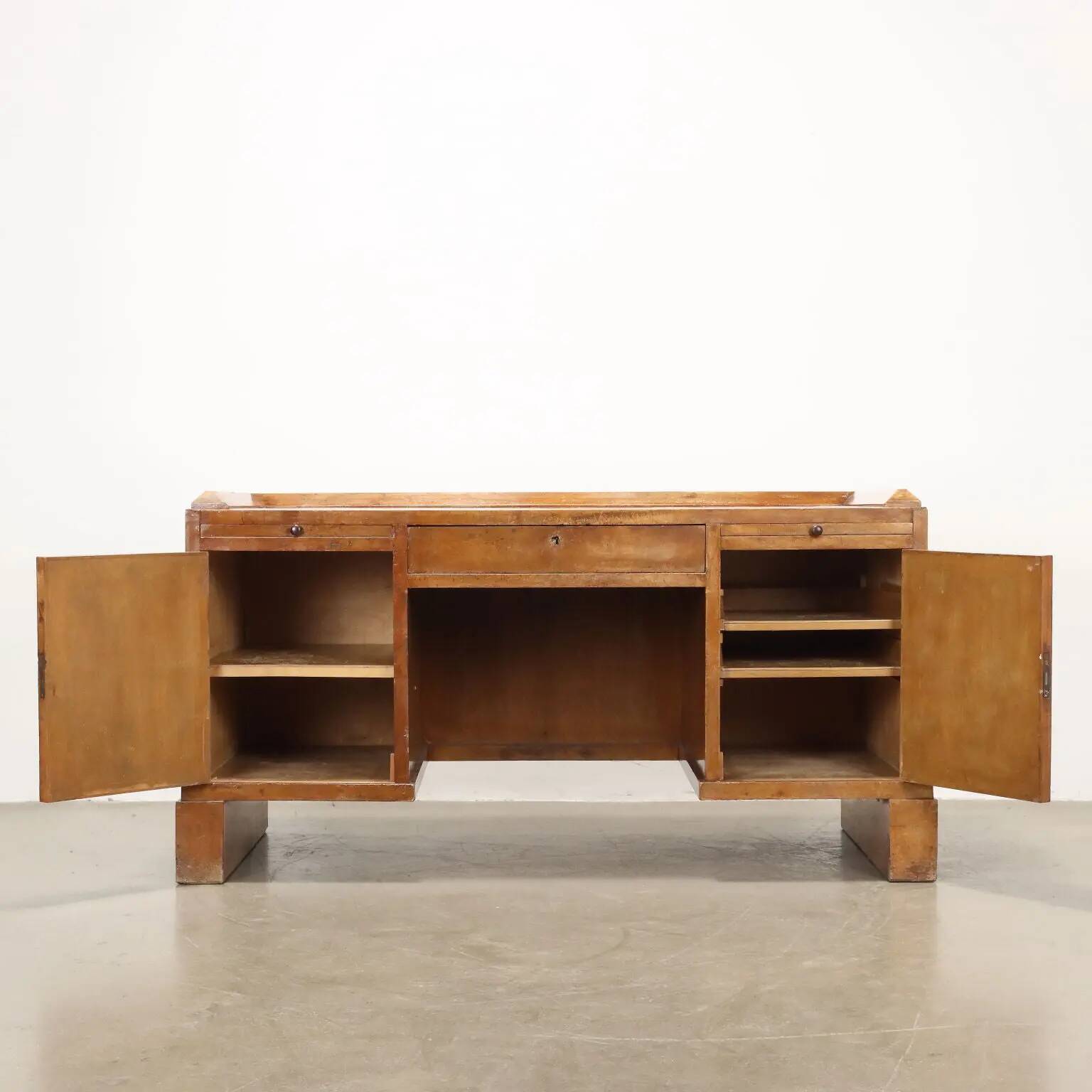Vintage writing desk in walnut veneer with drawers, Italy, 1920s.
