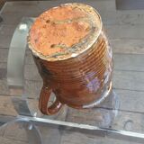 Veneered earth jug