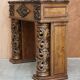 Antique fireplace from around 1880 in solid hand-carved elm with openwork columns.