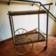 Golden metal serving trolley