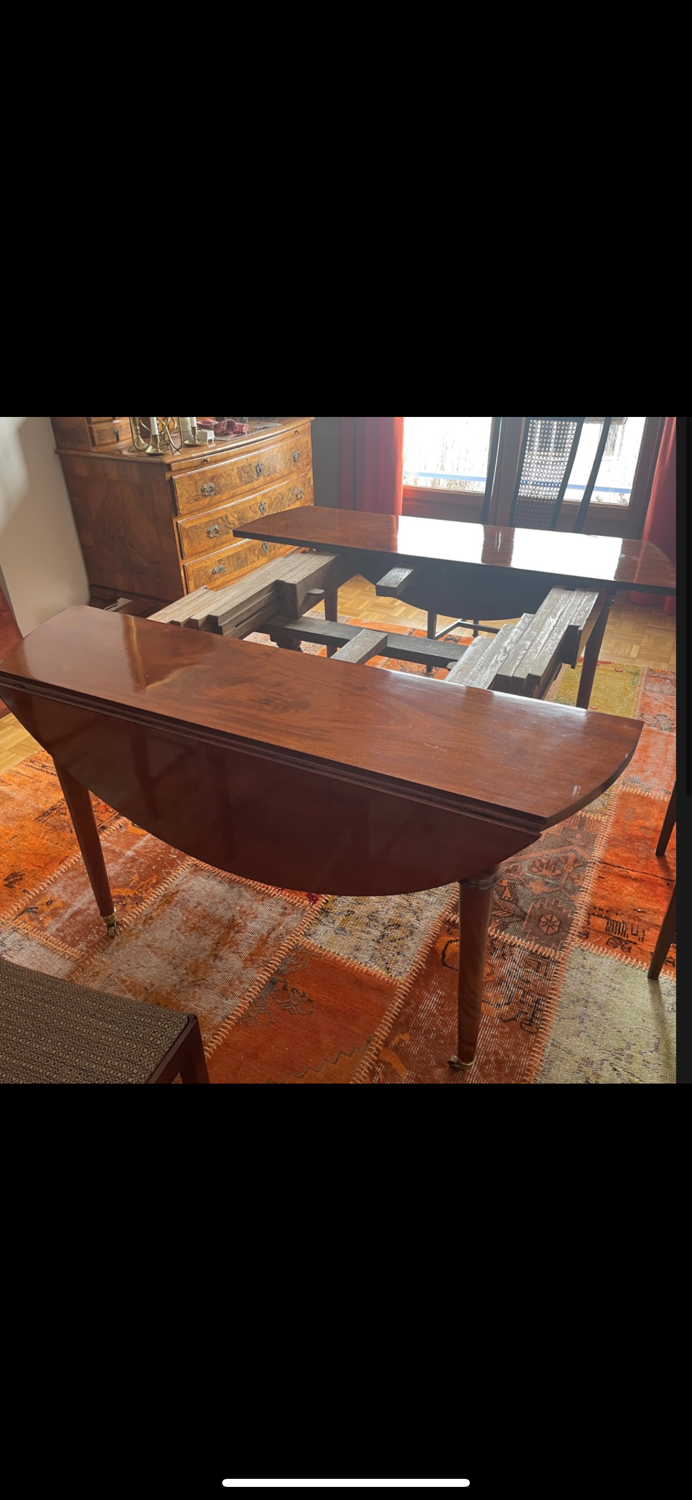 Solid mahogany dining table from the Louis XVI period, extendable.
