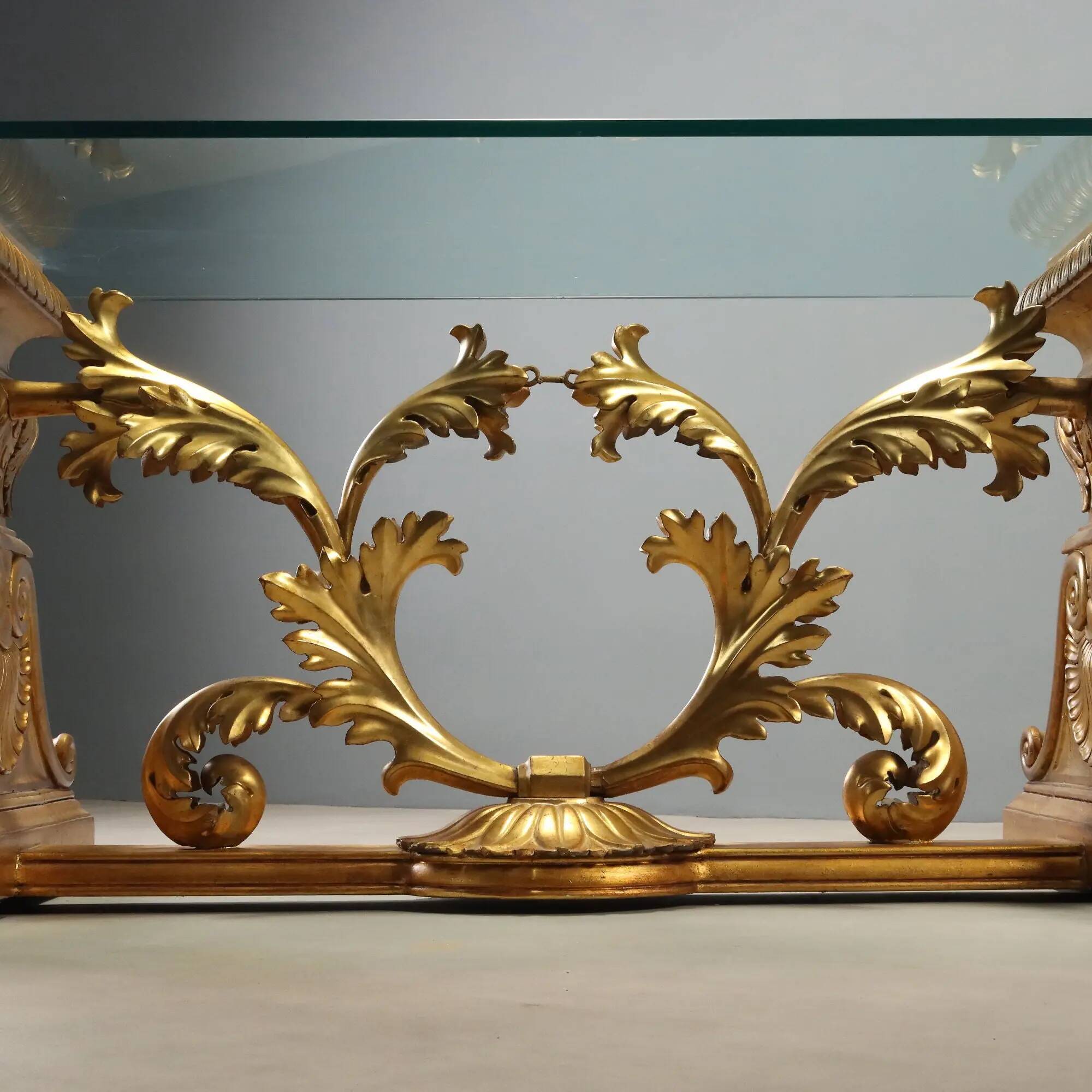 Antique coffee table in gilded wood with a glass top, Italy, 20th century.