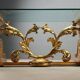 Antique coffee table in gilded wood with a glass top, Italy, 20th century.