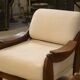 Brutalist pair of armchairs in mahogany and cream boucle 1970s.