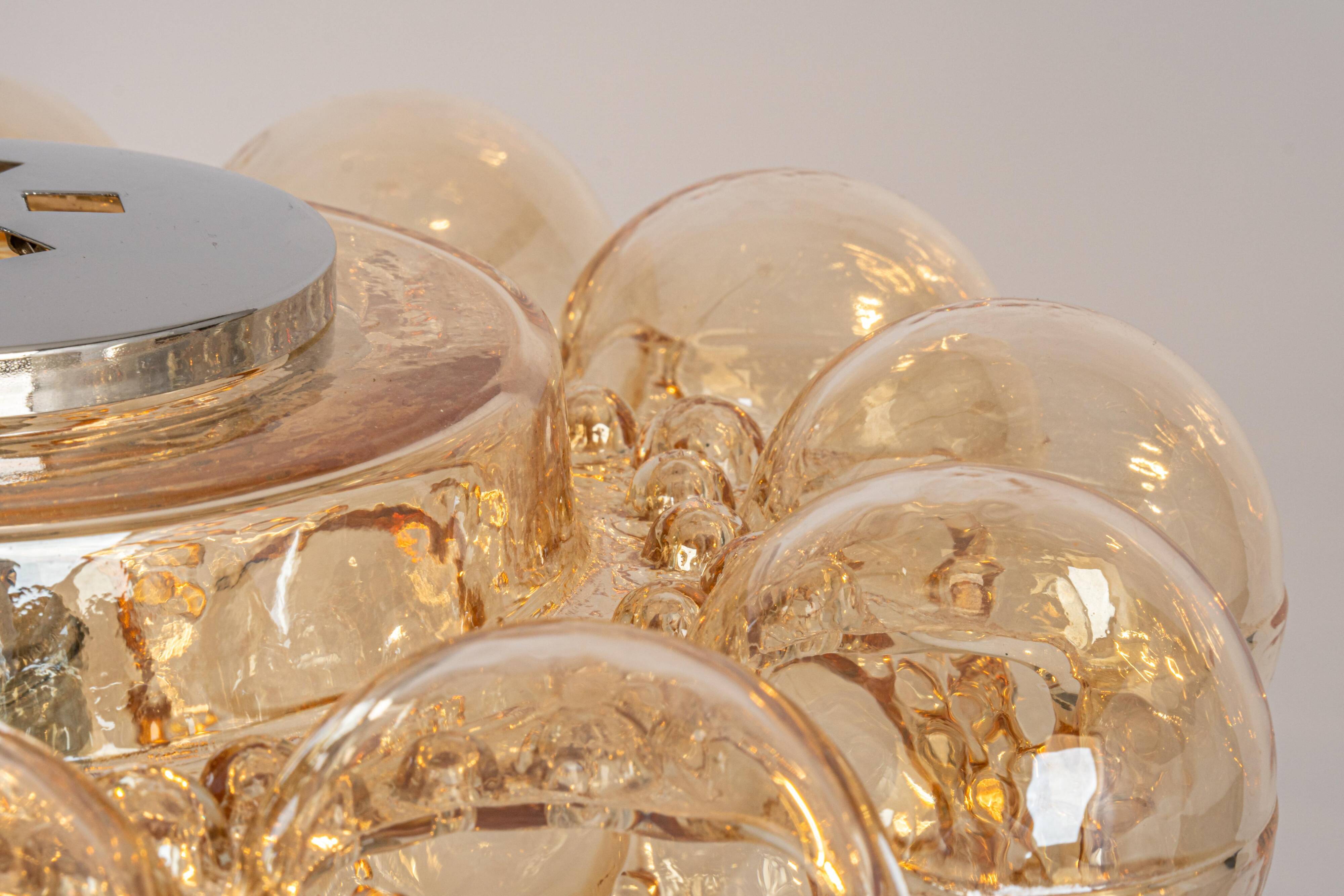 Large amber bubble glass pendant light by Helena Tynell for Limburg, Germany, 1970s.