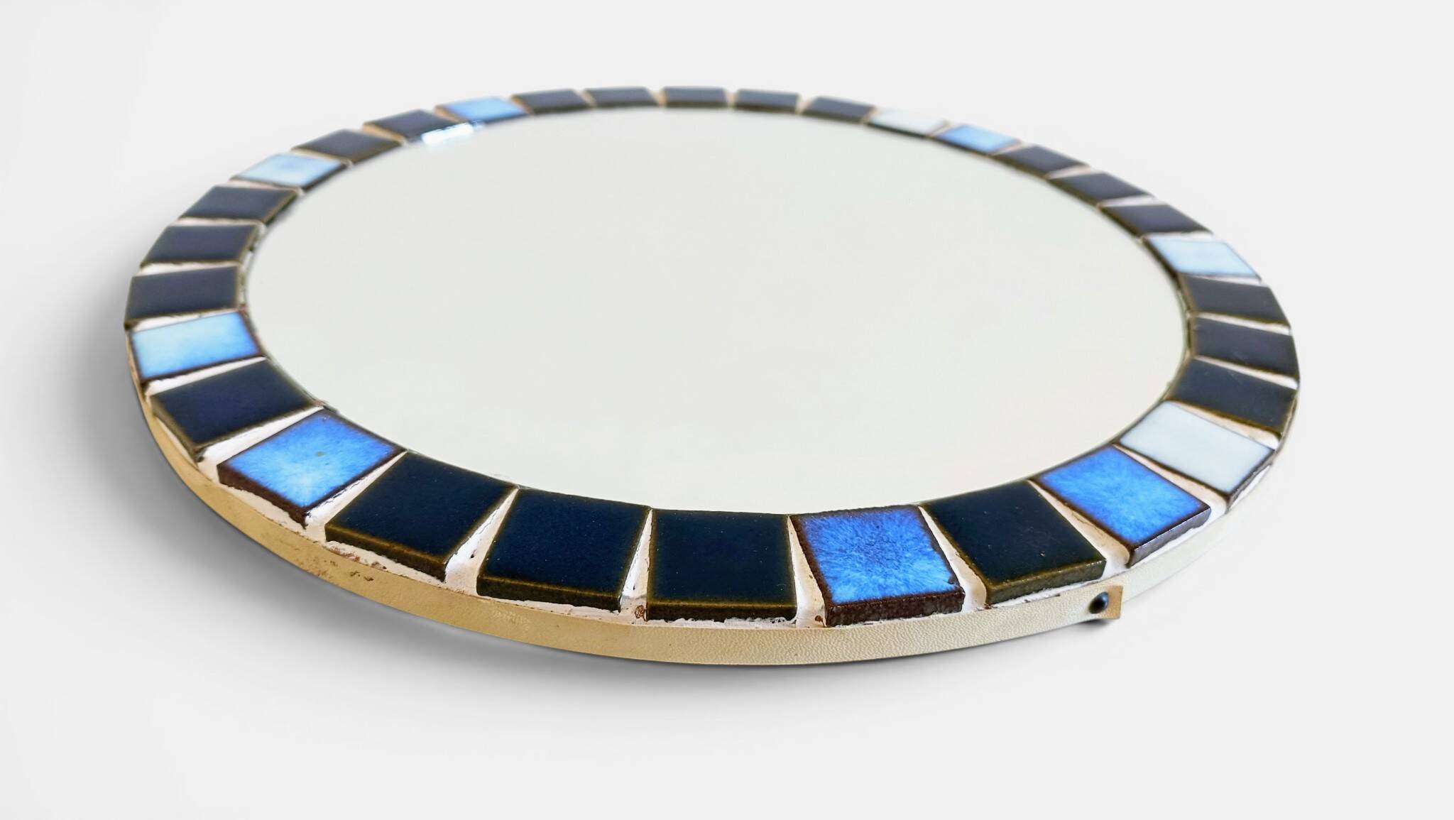 Round mosaic mirror in the style of Vallauris, France circa 1970.