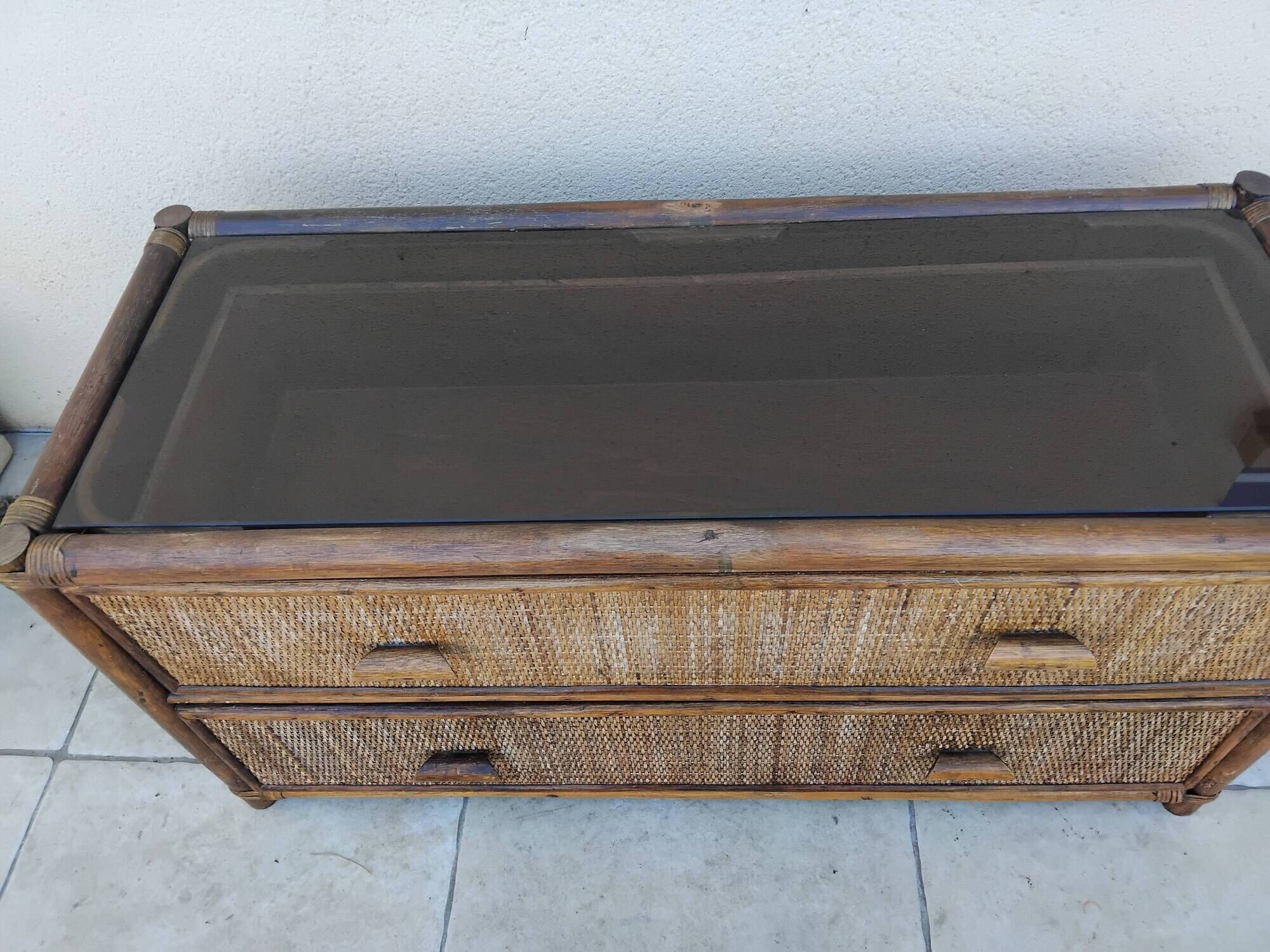 Vintage rattan and glass TV unit.