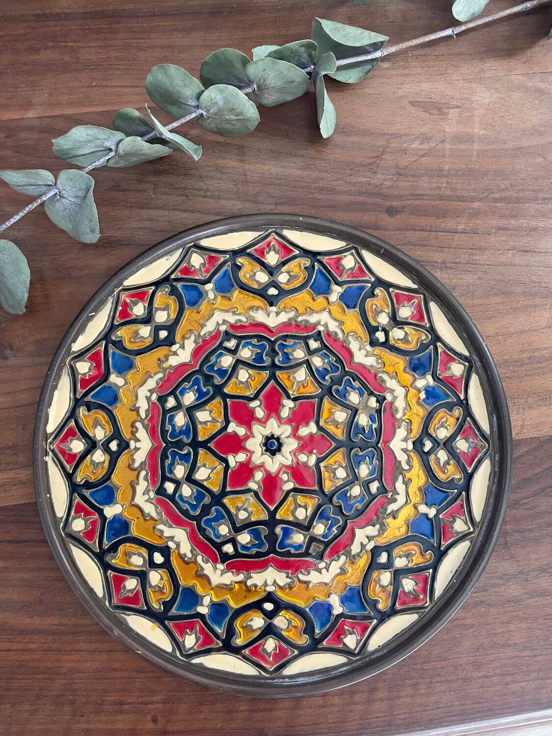 Enamelled brass plate