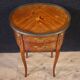 Pair of oval bedside tables in marquetry from the 20th century.