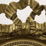 Miroir ancien ovale doré – style Louis XVI avec nœud ruban