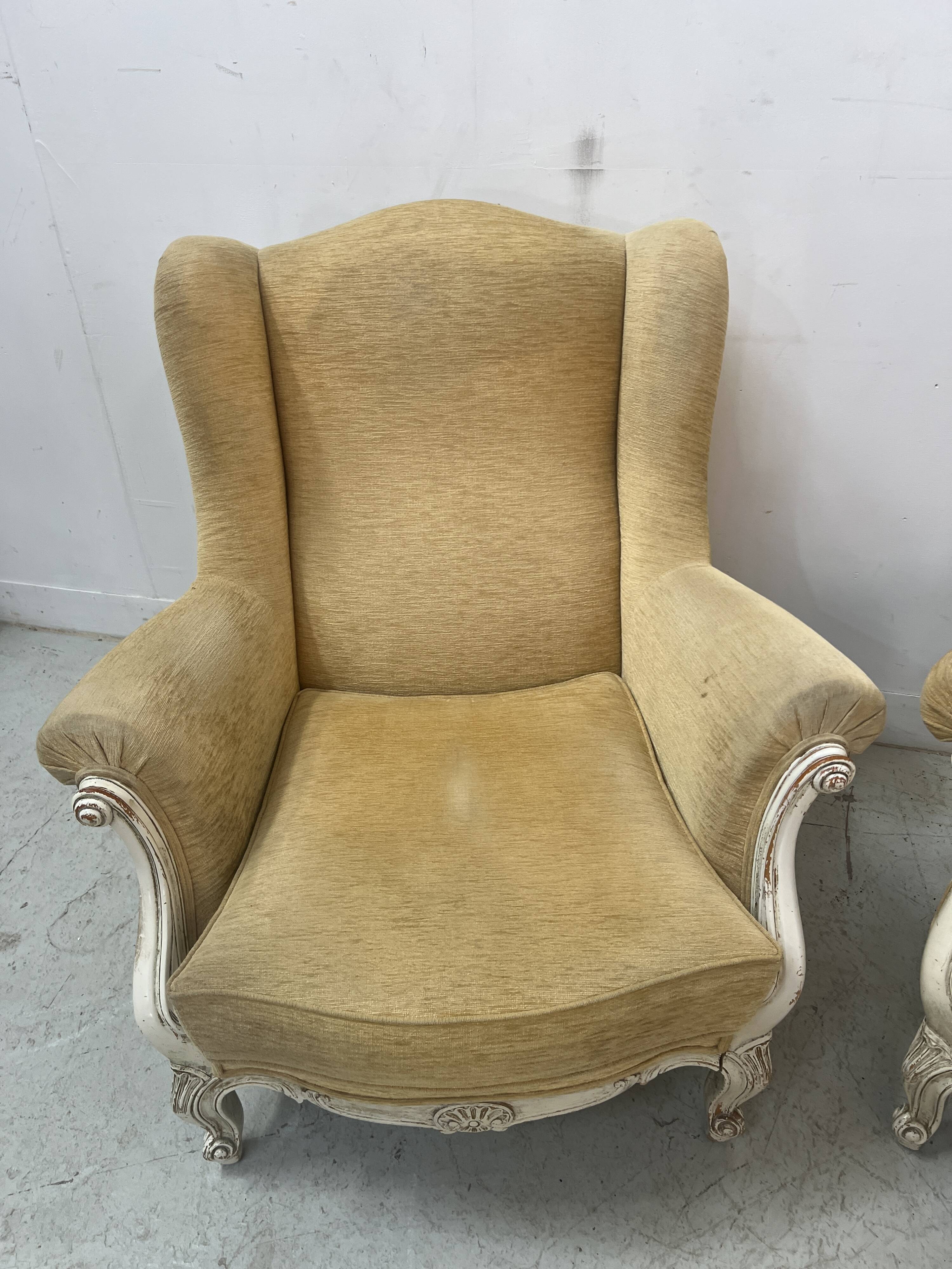 Pair of Louis XV style wing chairs in patinated beech, 20th century