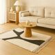 Atlas Berber rug in ecru with organic black pattern.