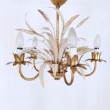 Vintage wrought iron chandelier decorated with golden and beige reeds