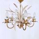 Vintage wrought iron chandelier decorated with golden and beige reeds