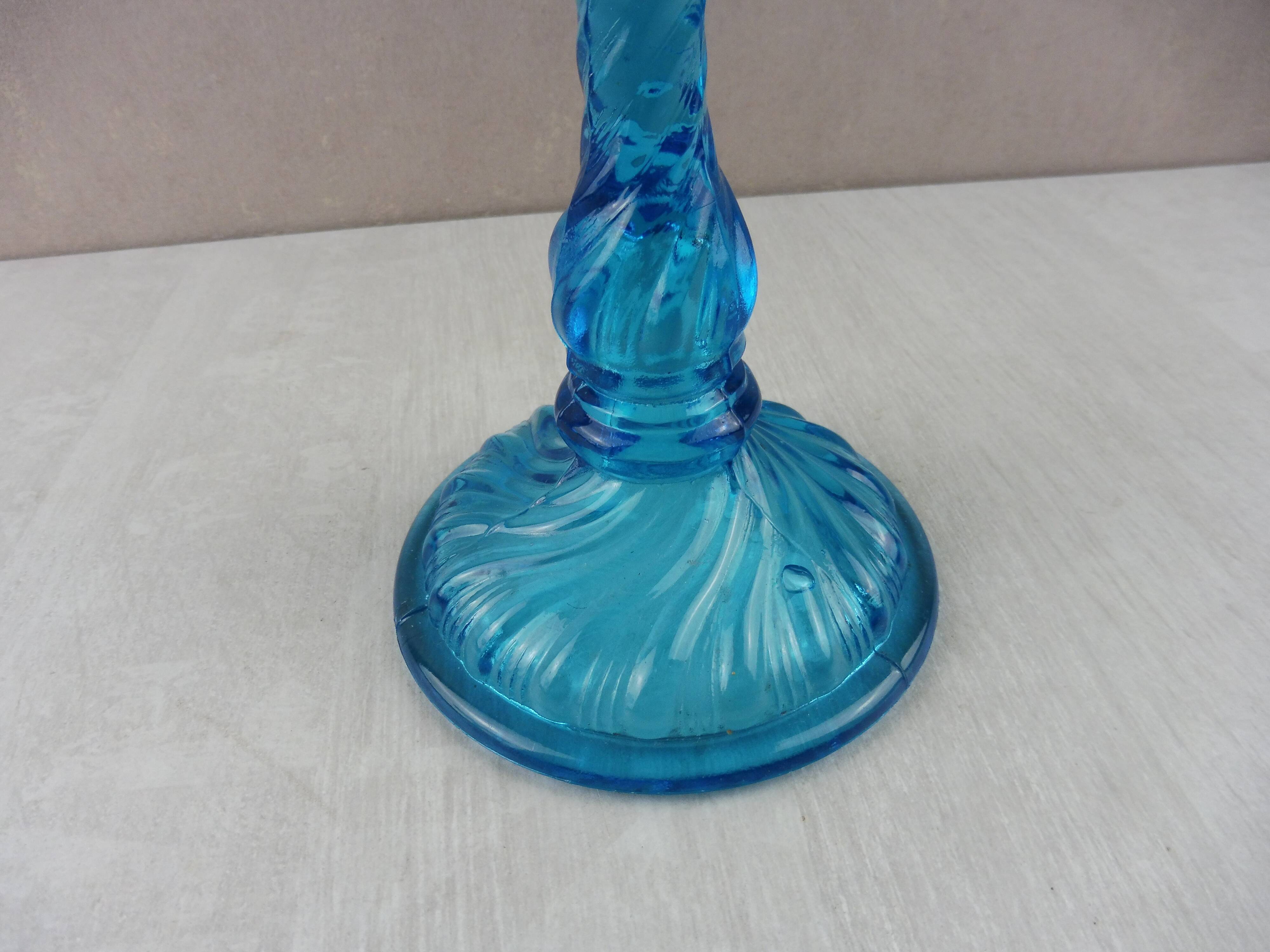 Old candlestick, blue molded glass