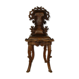 Sculpted chair in "black drill" style