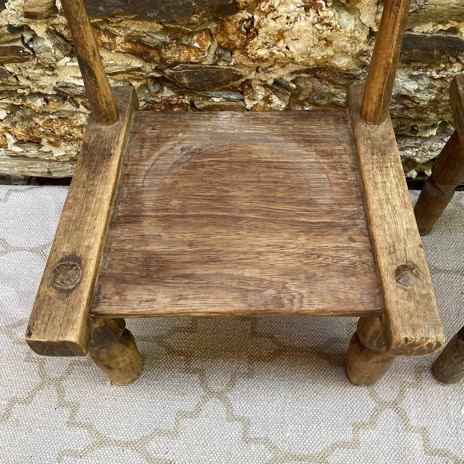 Ancient Baoulé African chairs in carved wood, Wabi-Sabi.