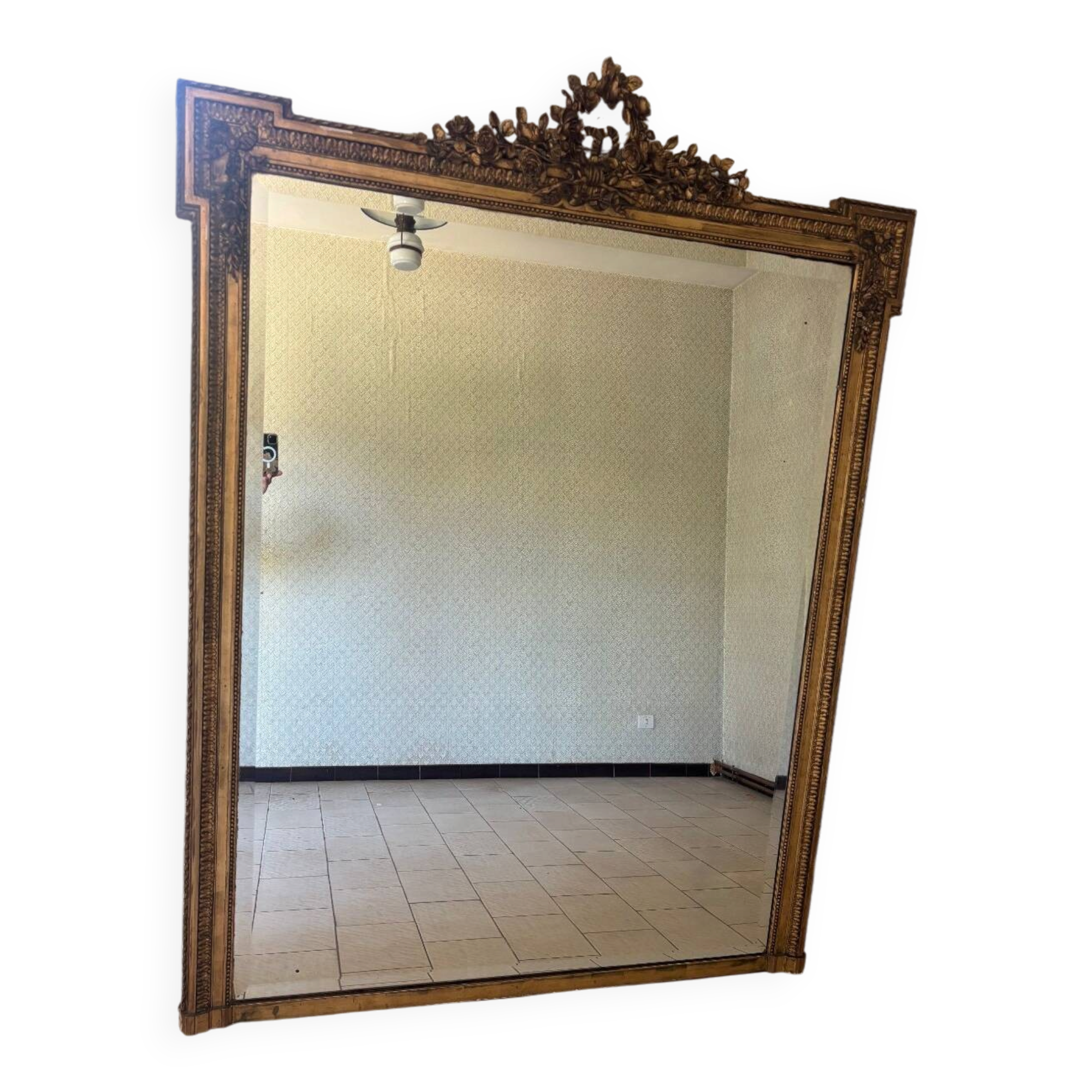 Large mirror from the Napoleonic III era with a floral pediment.