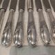 12 silver-plated metal table knives with rocaille ribbon decoration, 25.1 cm