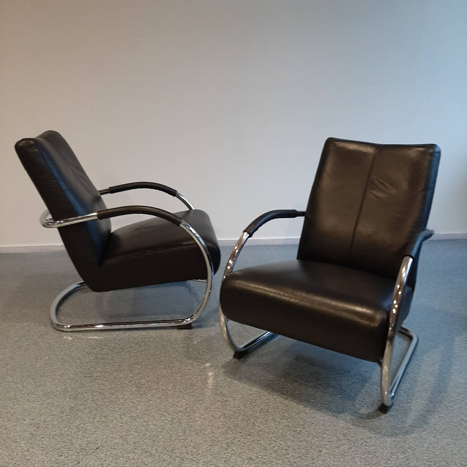 Pair of tubular armchairs