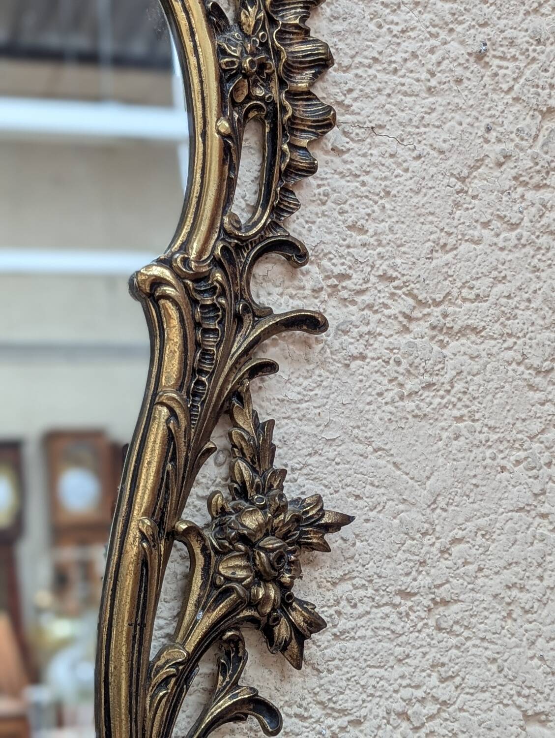 Gold metal wall mirror