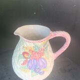 Glazed ceramic slip jug with vintage basket and fruit motif