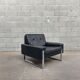 Pair of black leather armchairs