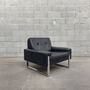 Pair of black leather armchairs