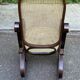 Rocking-chair vintage en bois massif courbé et cannée