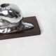 Silver snail candlestick on a teak base 1960