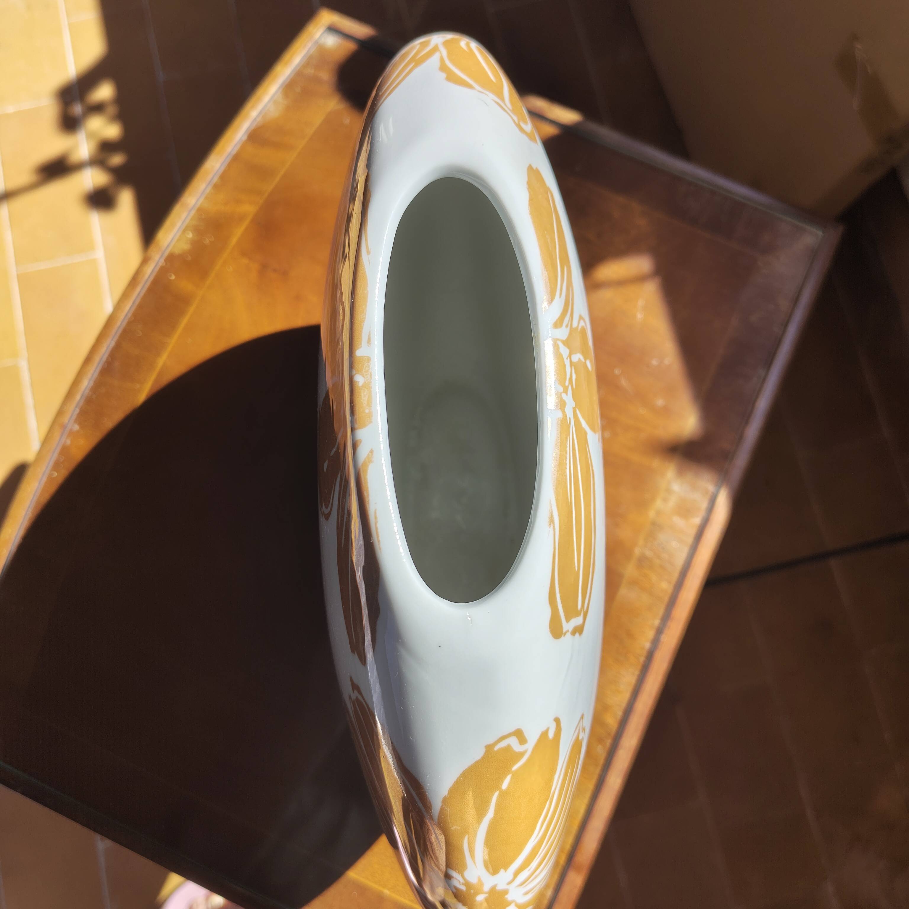 Large vase with golden flowers in ceramic