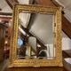 Wooden mirror with gilded stucco