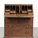 Antique English oak secretary from the 18th century with a stepped interior