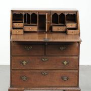 Antique English oak secretary from the 18th century with a stepped interior