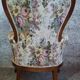 Louis XV style armchair with floral jacquard upholstery.