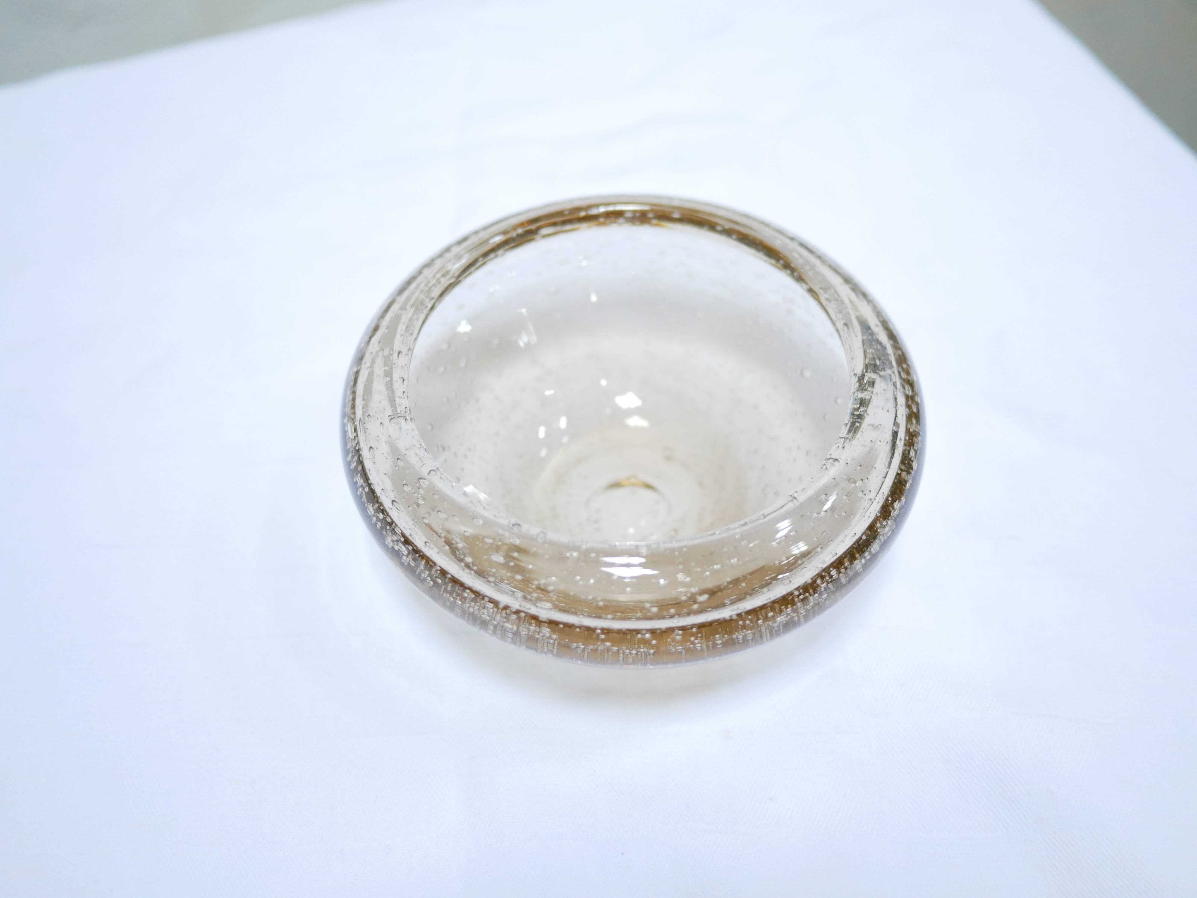 Empty vintage glass pocket blown by the glassworks of Biot