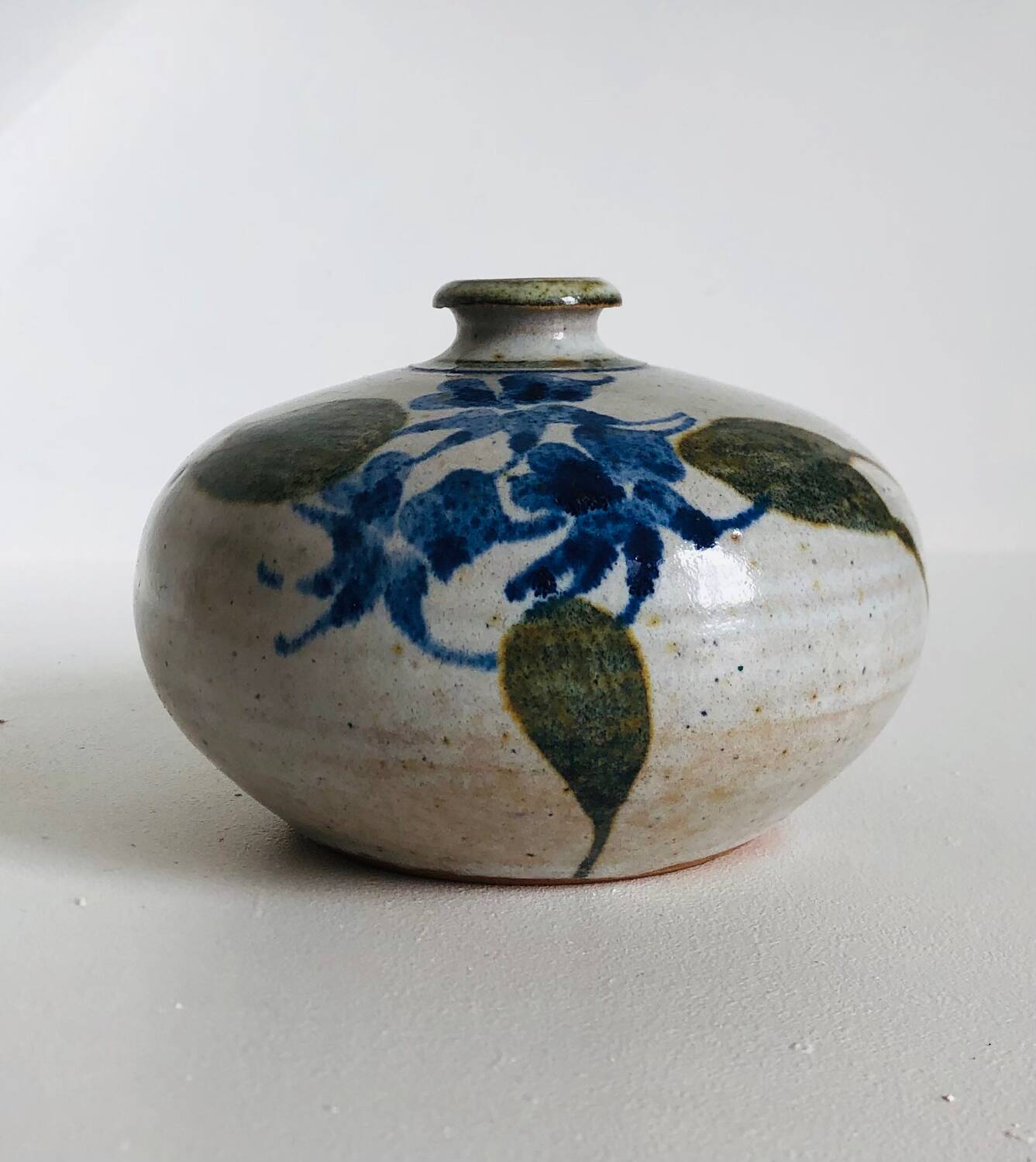 Ceramic bud vase with floral decoration