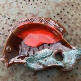 Empty pocket in glazed ceramic slip in the shape of vintage fish
