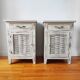 Pair of patinated bedside tables and end tables